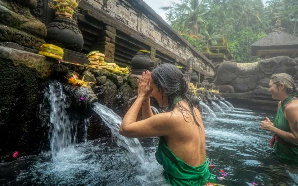 woman standing in front of flowing water